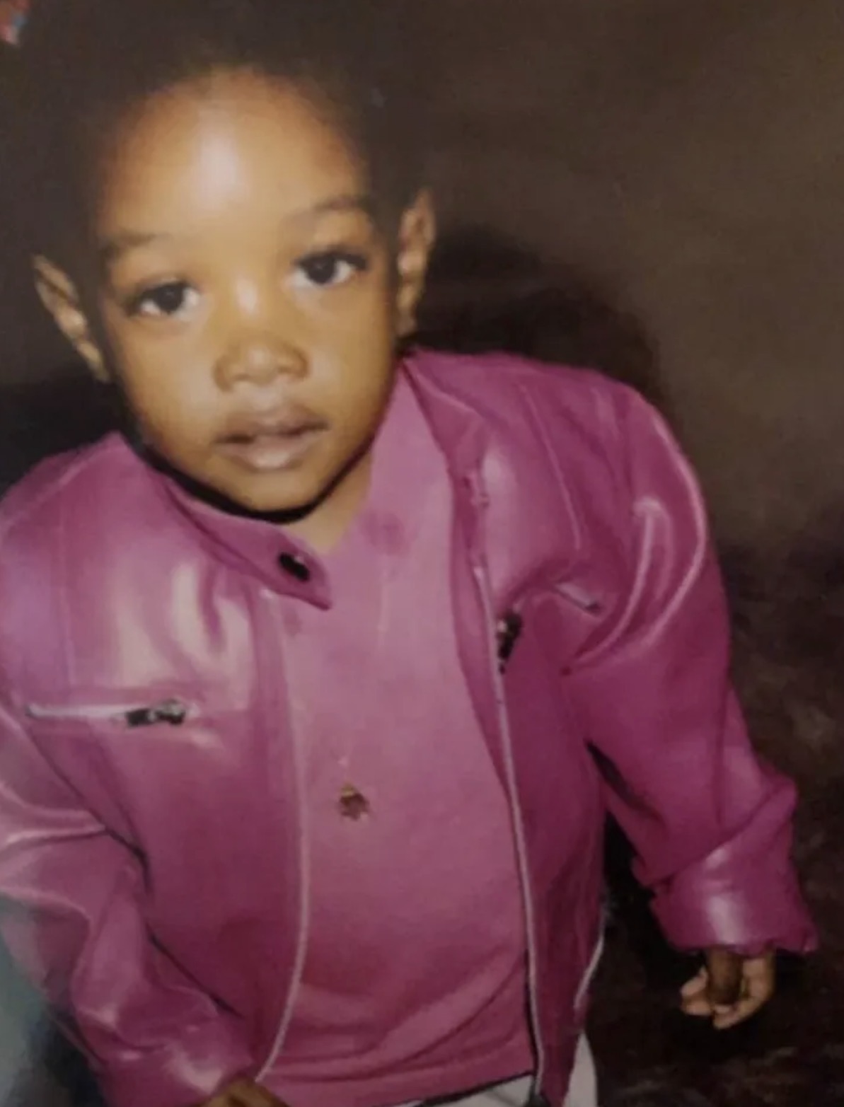 Childhood photo in pink leather jacket